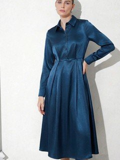 Full-length front view of the teal satin a-line midi shirt dress, showing its silhouette and design details.