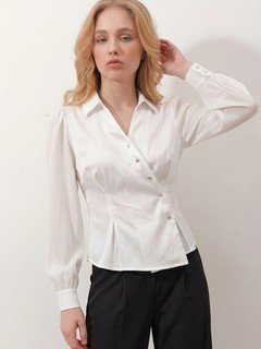 Angled front view of the ivory satin button-detail wrap blouse, showing its silhouette and design details.
