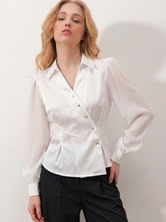 Front view of the ivory satin button-detail wrap blouse, showing its silhouette and design details.