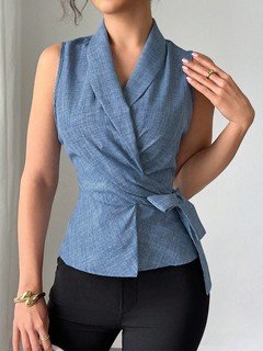 Styled front view of the blue sleeveless side-tie wrap top, showing its silhouette and design details.