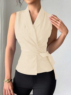 Styled front view of the cream sleeveless side-tie wrap top, showing its silhouette and design details.