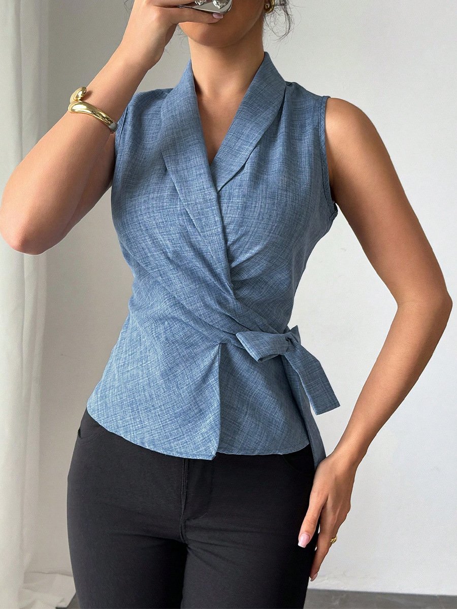 Blue Sleeveless Side-Tie Wrap Top – Front View Front view of the blue sleeveless side-tie wrap top, showing its silhouette and design details.