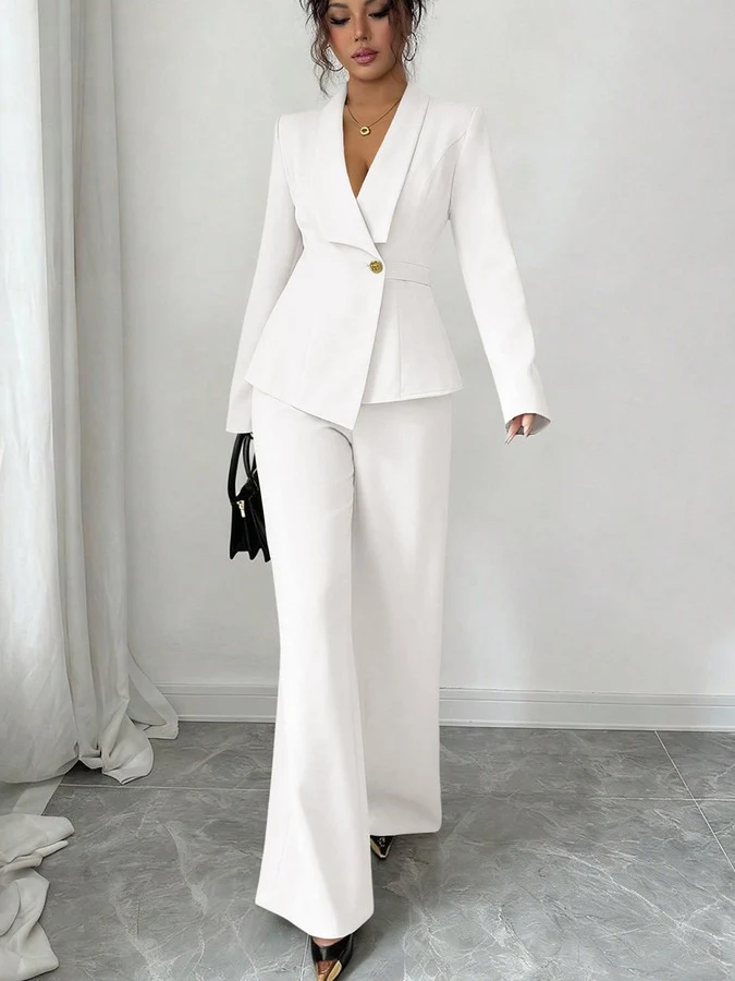 Angled front view of the ivory shawl-collar blazer pants set, showing its silhouette and design details.