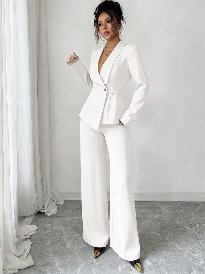 Front view of the ivory shawl-collar blazer pants set, showing its silhouette and design details.