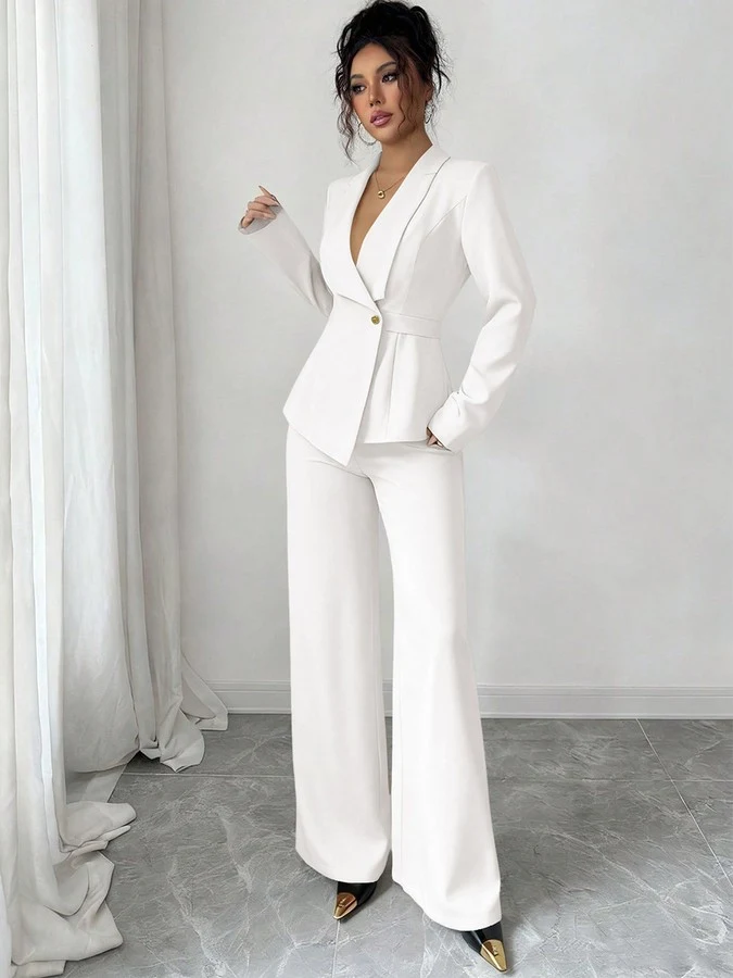 Front view of the ivory shawl-collar blazer pants set, showing its silhouette and design details.