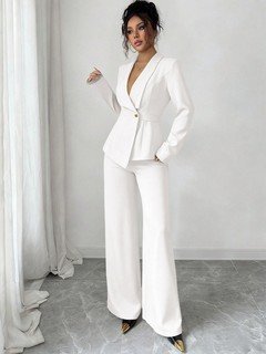 Front view of the ivory shawl-collar blazer pants set, showing its silhouette and design details.