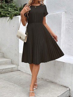 Full-length front view of the black short-sleeve pleated midi dress, showing its silhouette and design details.