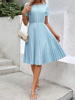Styled front view of the light blue short-sleeve pleated midi dress, showing its silhouette and design details.