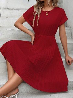 Styled front view of the red short-sleeve pleated midi dress, showing its silhouette and design details.
