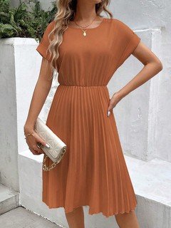 Front view of the rust short-sleeve pleated midi dress, showing its silhouette and design details.