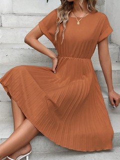 Full-length front view of the rust short-sleeve pleated midi dress, showing its silhouette and design details.