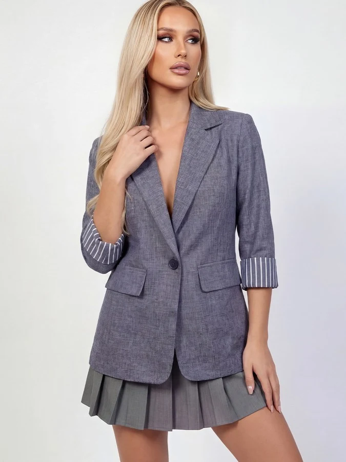 Front view of the gray striped-cuff tailored blazer, showing its silhouette and design details.