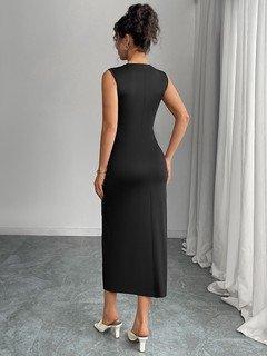 Angled back view of the black bow-trim side-slit midi dress, showing its silhouette and design details.