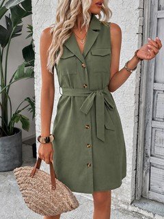 Lifestyle front view of the olive sleeveless button-front belted shirt dress, showing the silhouette and fit.