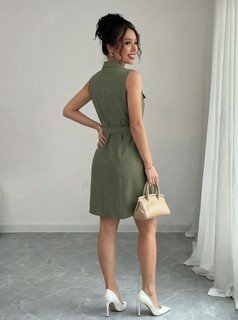 Studio back view of the olive sleeveless button-front belted shirt dress, showing the silhouette and fit.