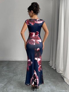 Angled back view of the navy floral ruched bodycon maxi dress, showing its silhouette and design details.