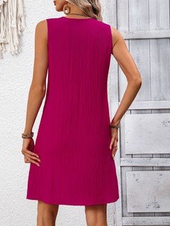 Back view of the fuchsia notch-neck sleeveless shift dress, showing its silhouette and design details.