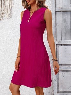 Front view of the fuchsia notch-neck sleeveless shift dress, showing its silhouette and design details.