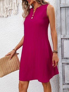 Lifestyle front view of the fuchsia notch-neck sleeveless shift dress, showing its silhouette and design details.