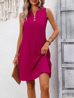 Styled front view of the fuchsia notch-neck sleeveless shift dress, showing its silhouette and design details.