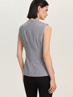Back view of the gray v-neck asymmetric wrap top, showing its silhouette and design details.