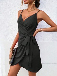 Angled front view of the black tie-waist faux-wrap mini dress, showing its silhouette and design details.