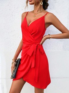 Angled front view of the red tie-waist faux-wrap mini dress, showing its silhouette and design details.