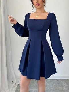 Front view of the navy square-neck bishop-sleeve dress, showing its silhouette and design details.