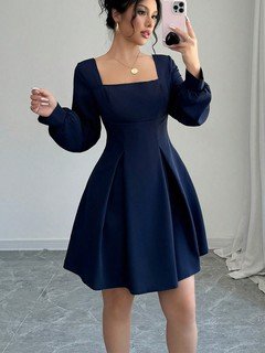 Full-length front view of the navy square-neck bishop-sleeve dress, showing its silhouette and design details.
