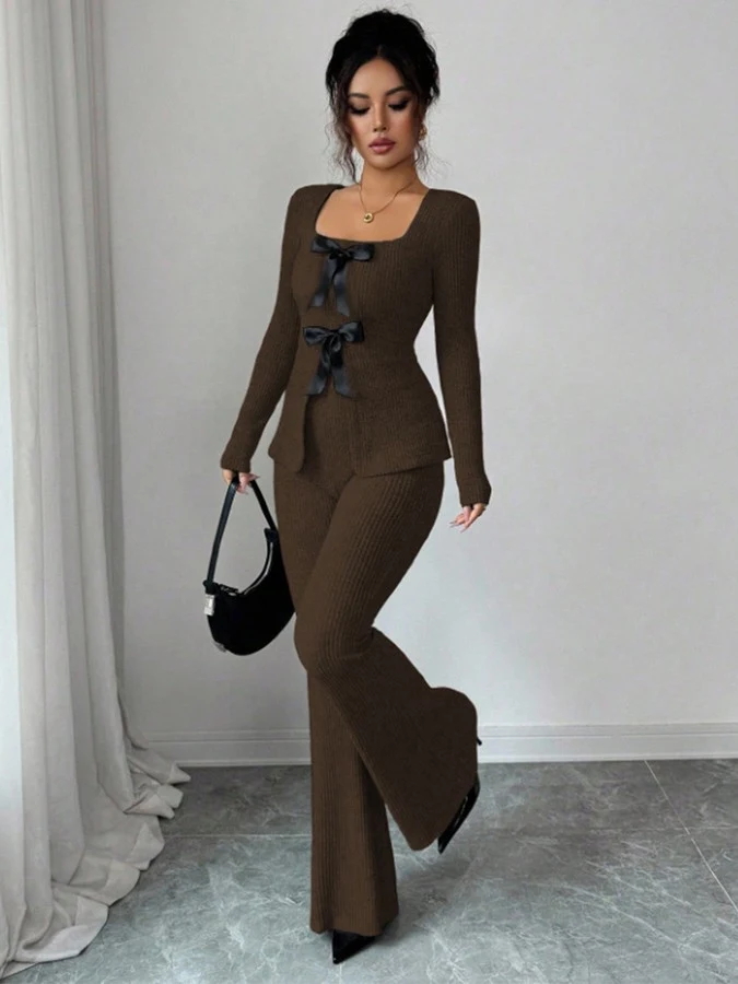 Front view of the brown bow-front top and flared pants set, showing its silhouette and design details.