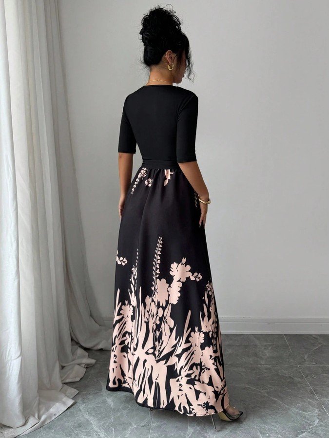 Back view of the black square-neck floral-hem three-quarter-sleeve maxi dress, showing the silhouette and fit.