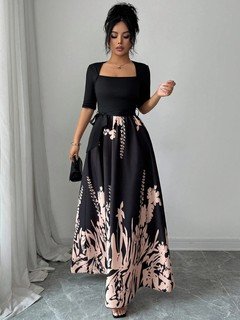 Front close up of the black square-neck floral-hem three-quarter-sleeve maxi dress, showing square neckline, floral border skirt and tie waist.
