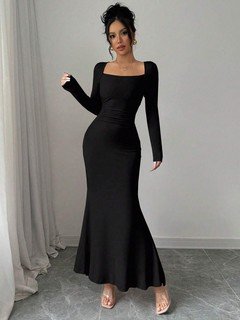 Angled front view of the black square-neck fishtail maxi dress, showing its silhouette and design details.