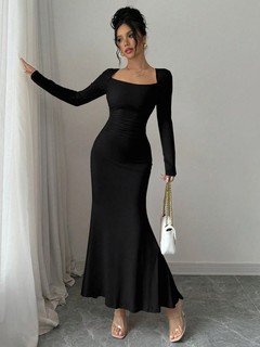 Lifestyle front view of the black square-neck fishtail maxi dress, showing its silhouette and design details.