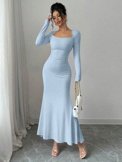 Styled front view of the light blue square-neck fishtail maxi dress, showing its silhouette and design details.
