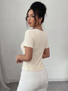 Side view of the ivory square-neck short-sleeve fitted top, showing the silhouette and fit.