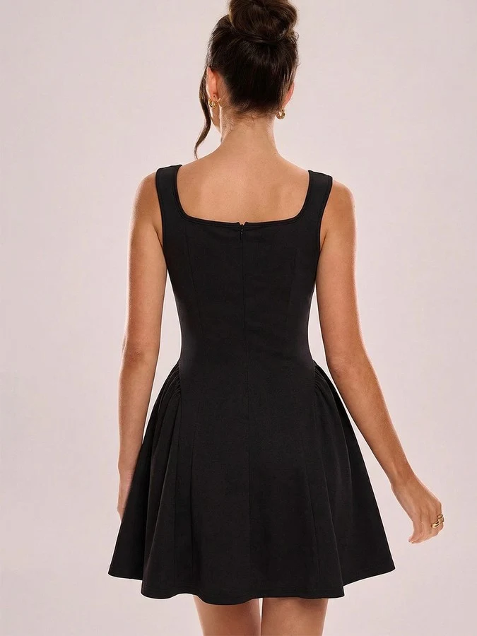 Back view of the black square-neck fit-and-flare dress, showing its silhouette and design details.