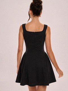 Back view of the black square-neck fit-and-flare dress, showing its silhouette and design details.