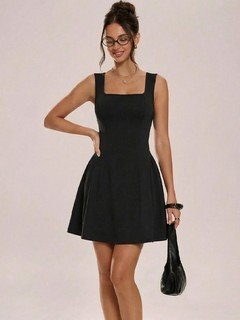 Styled front view of the black square-neck fit-and-flare dress, showing its silhouette and design details.