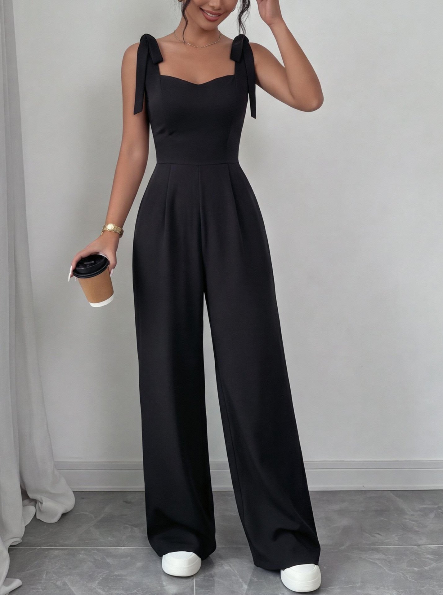 Black Square-Neck Tie-Strap Wide-Leg Jumpsuit – Front View Front view of the black square-neck tie-strap wide-leg jumpsuit, showing the silhouette and fit.