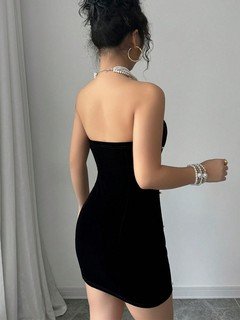 Back view of the black embellished strapless mini dress, showing its silhouette and design details.