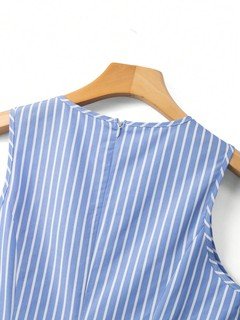 Back neck detail of the blue striped bow-waist sleeveless fit-and-flare mini dress, showing vertical stripes, bow waist and flared mini skirt.