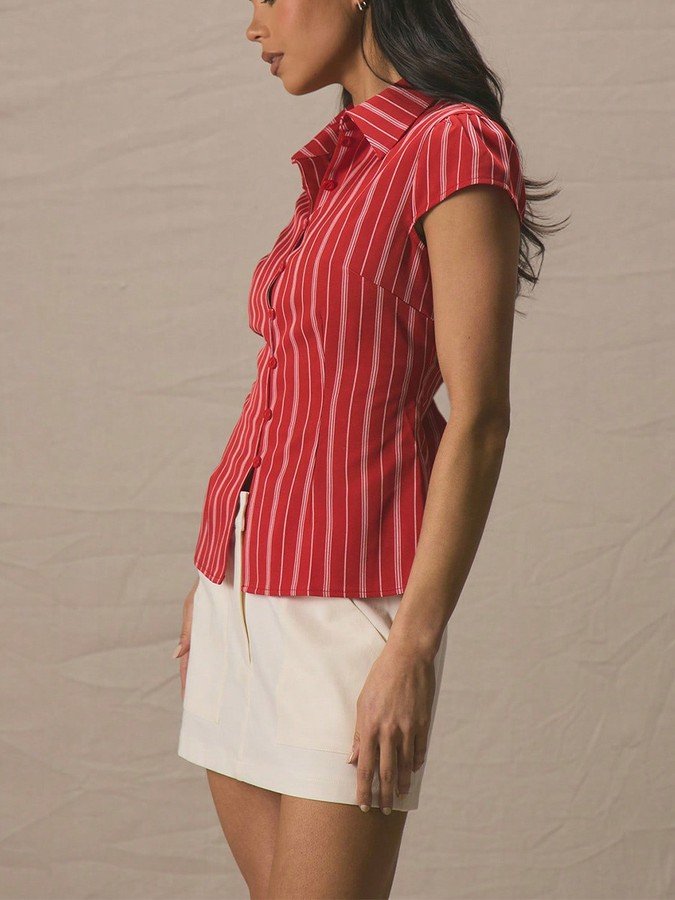 Angled front view of the red striped cap-sleeve fitted shirt, showing its silhouette and design details.