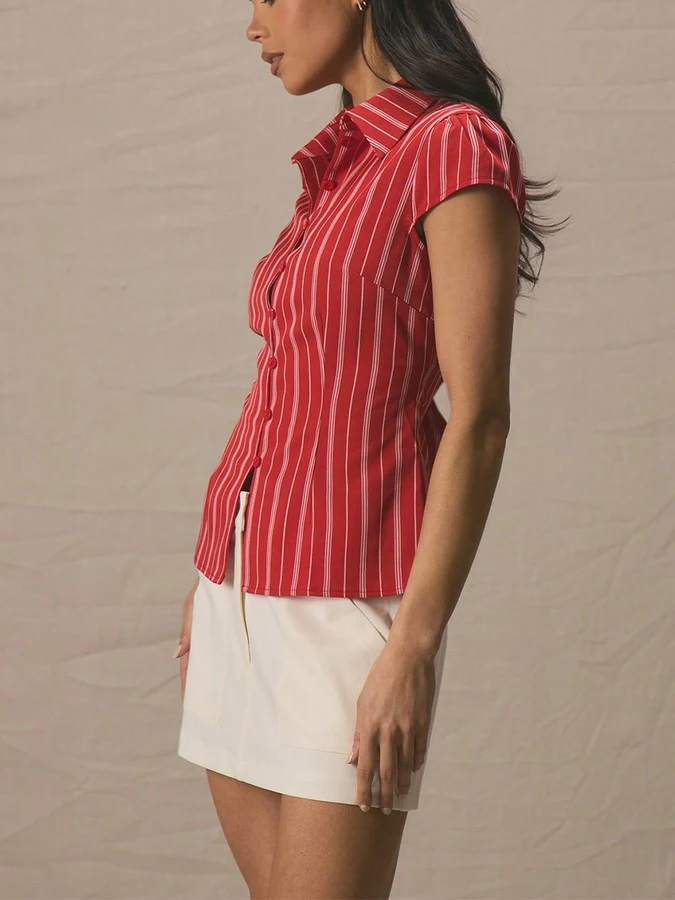 Angled front view of the red striped cap-sleeve fitted shirt, showing its silhouette and design details.