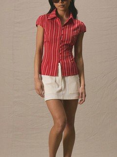 Styled front view of the red striped cap-sleeve fitted shirt, showing its silhouette and design details.