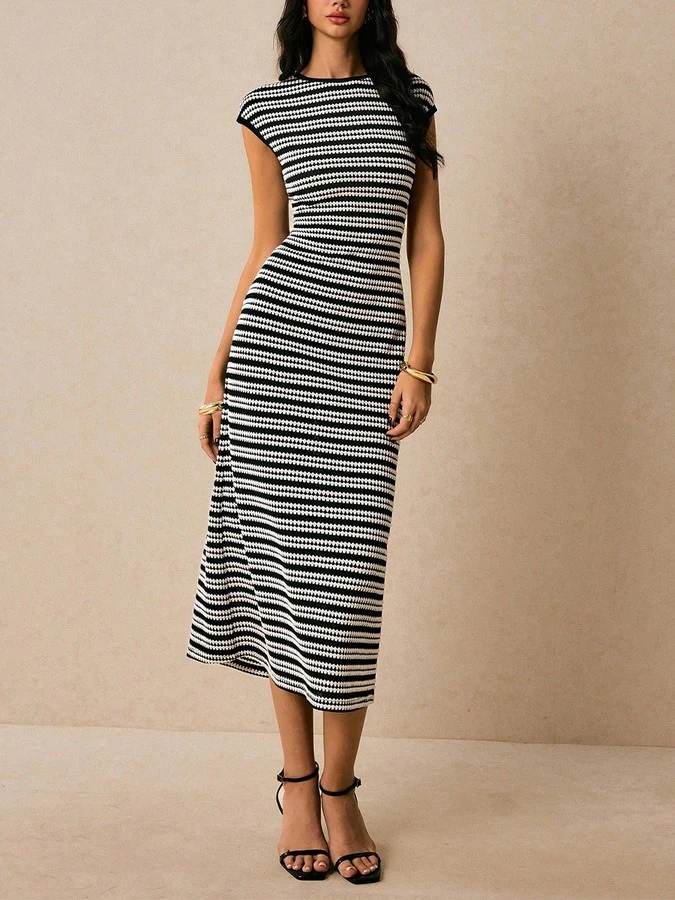 Front view of the black and white striped knit bodycon midi dress, showing its silhouette and design details.