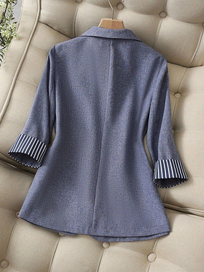 Garment back view of the gray striped-cuff three-quarter-sleeve tailored blazer, showing the silhouette and fit.