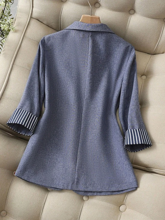 Garment back view of the gray striped-cuff three-quarter-sleeve tailored blazer, showing the silhouette and fit.