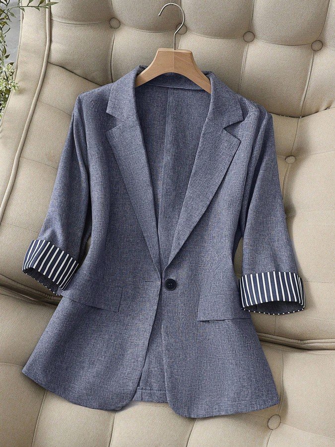 Garment front view of the gray striped-cuff three-quarter-sleeve tailored blazer, showing the silhouette and fit.