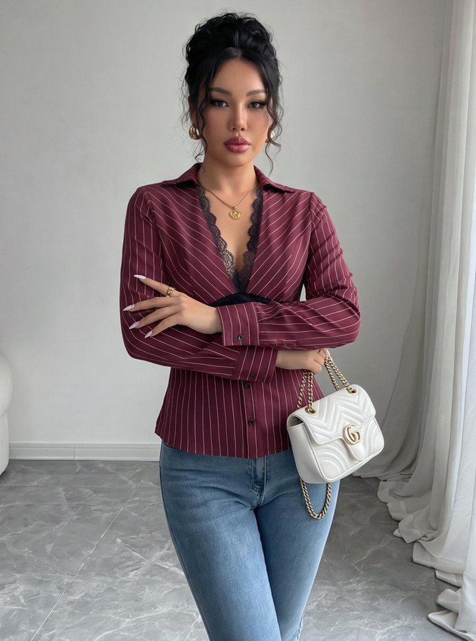 Styled front view of the burgundy striped lace-trim v-neck long-sleeve top, showing the silhouette and fit.
